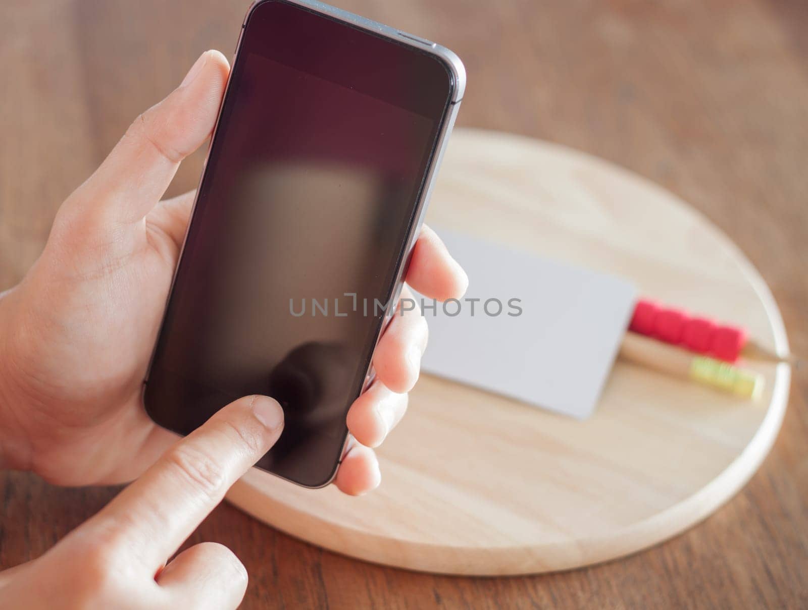 Smart phone in a woman's hand, stock photo