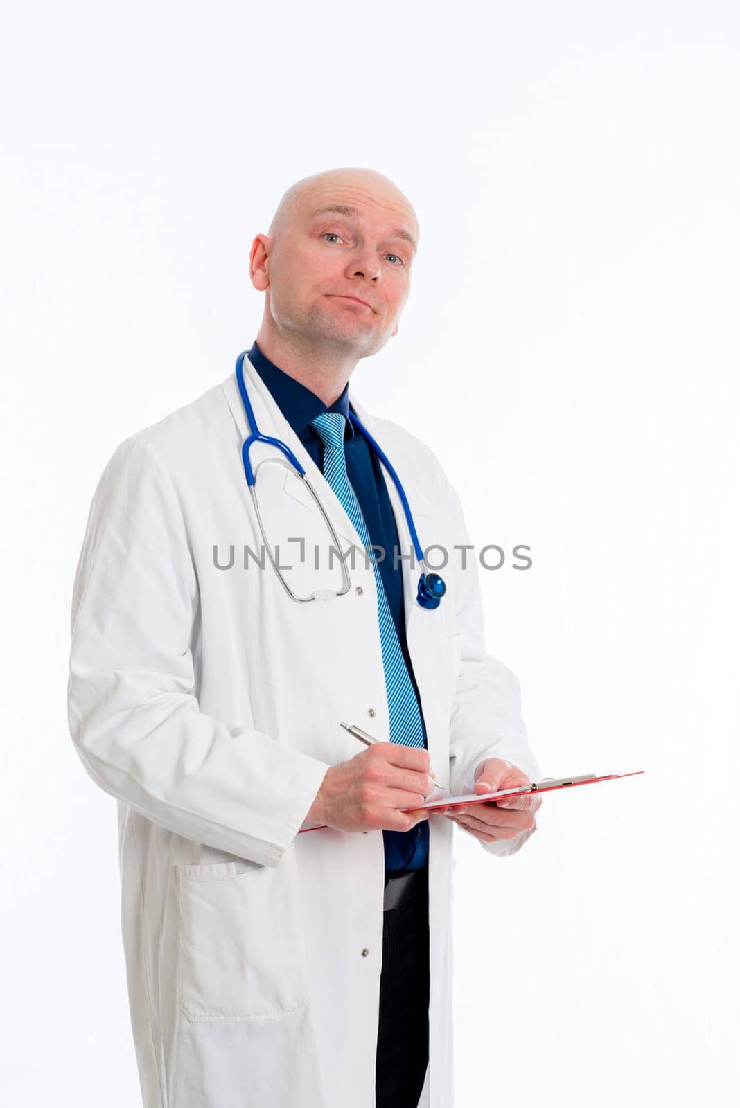 friendly young doctor with clipboard in front of white background