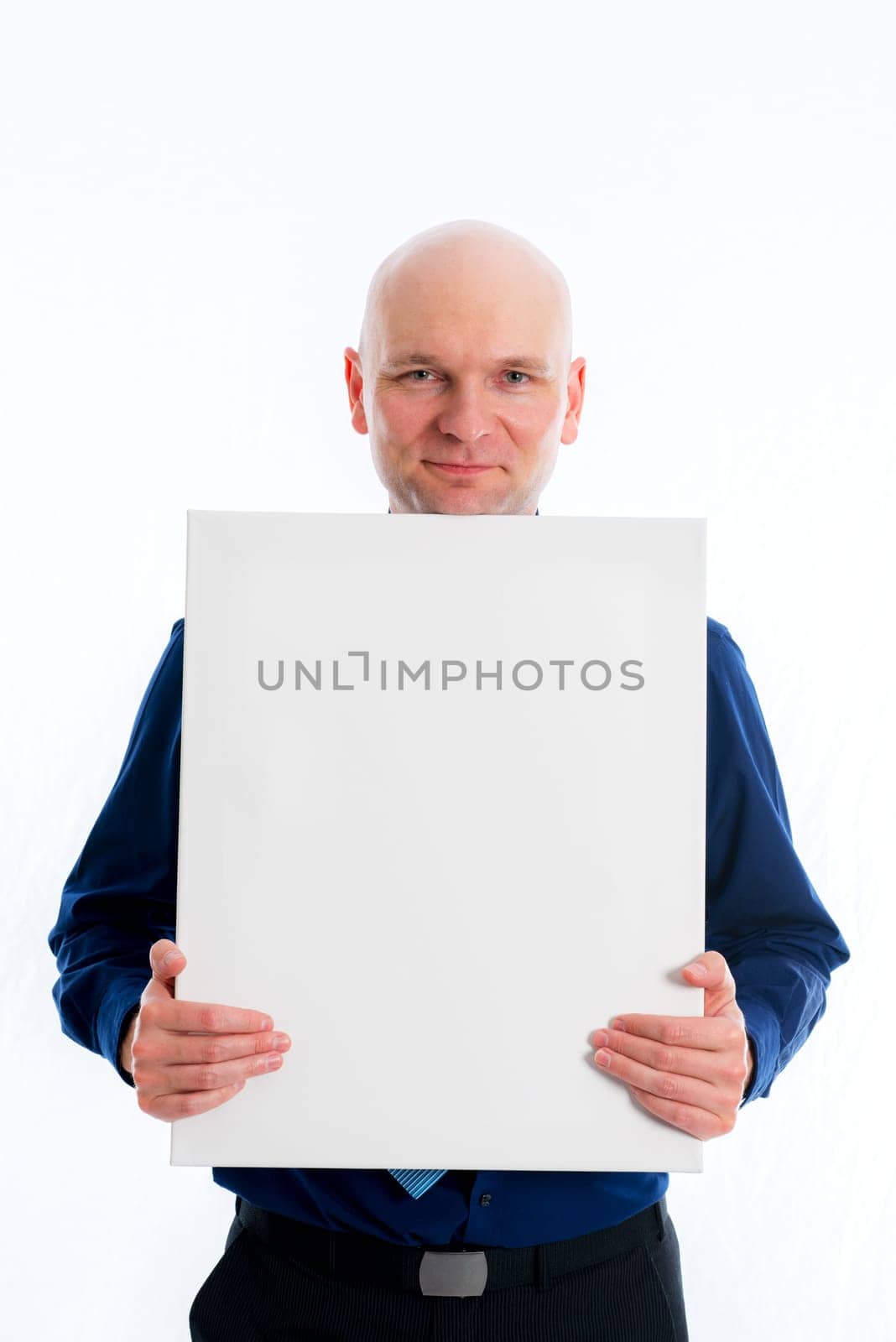 young bald headed man with a white canvas