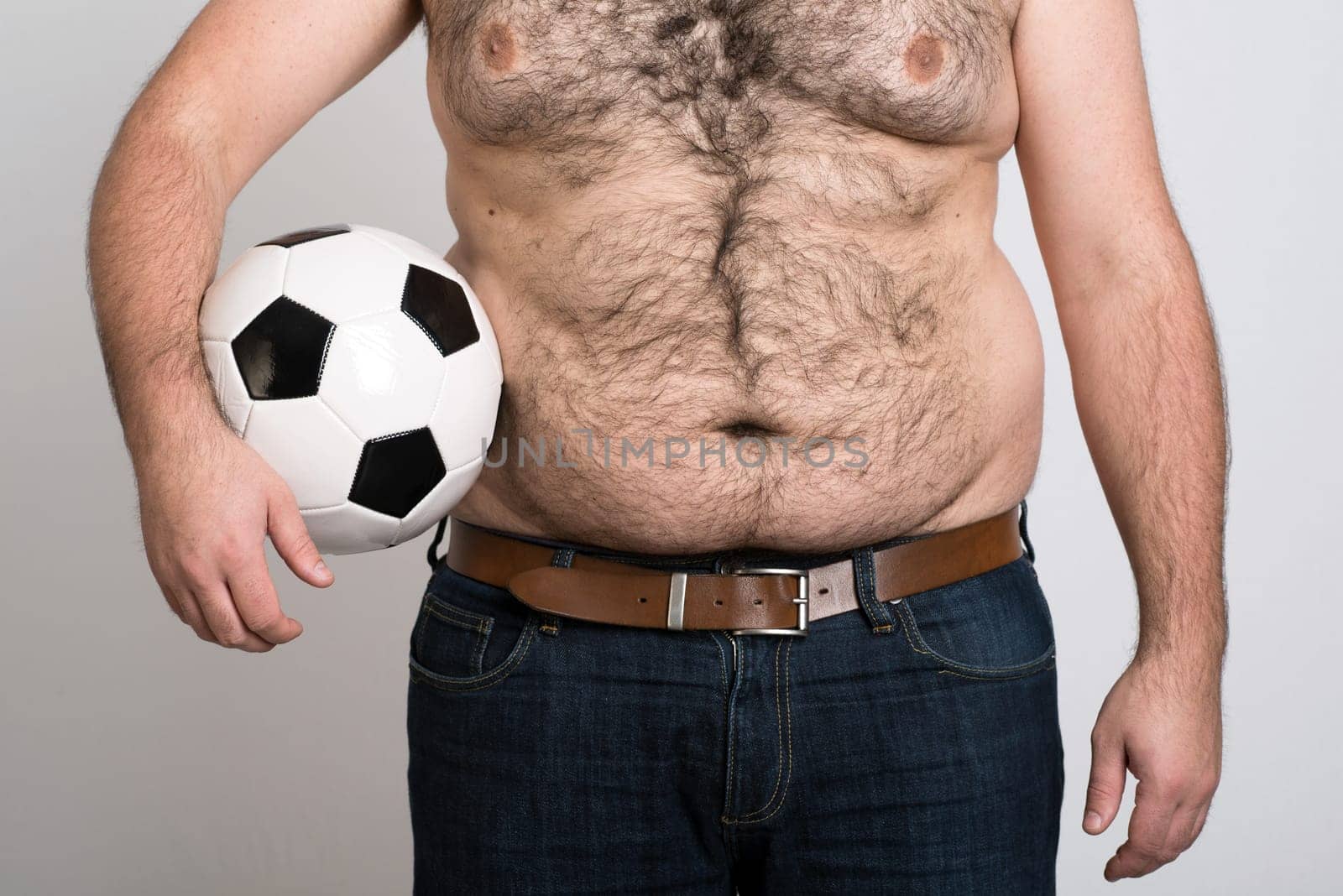 portly belly of a man with black and white football
