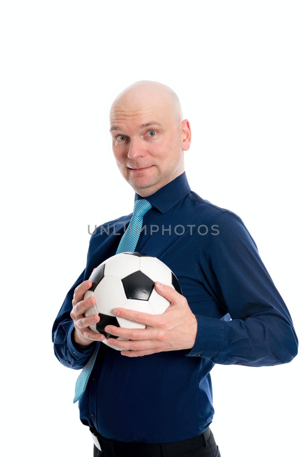 portrait of a young businessman with soccer ball in front of white background