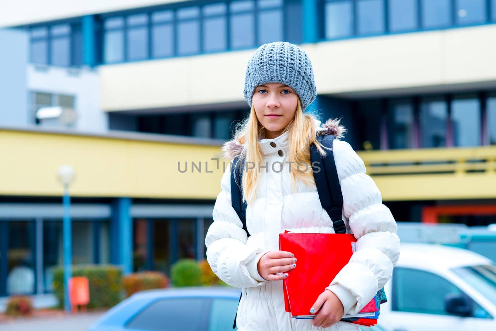 nice blond girl in front of school building