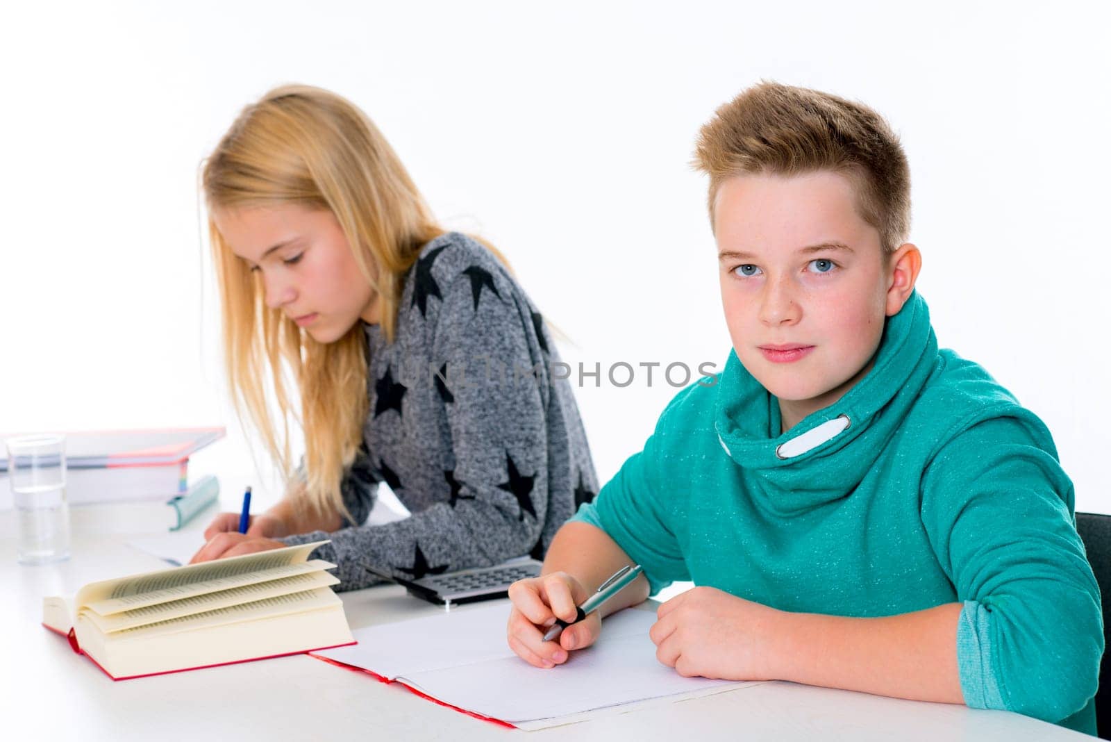 girl and boy learning together in the classroom
