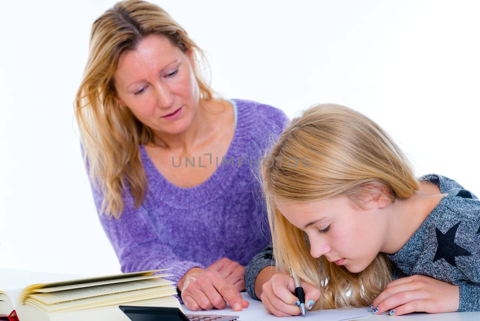 girl learning together with teacher in the classroom