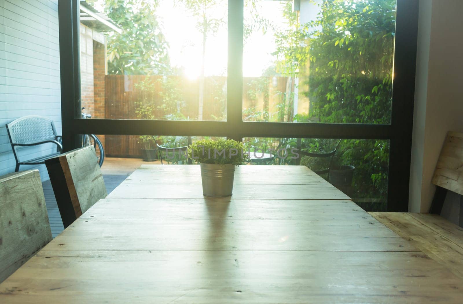 Simply plant bucket decorated on wooden table, stock photo