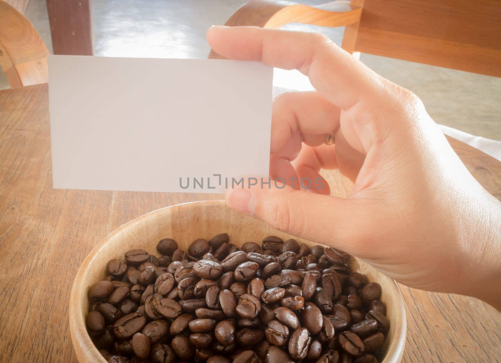 Roasted coffee bean and business card, stock photo