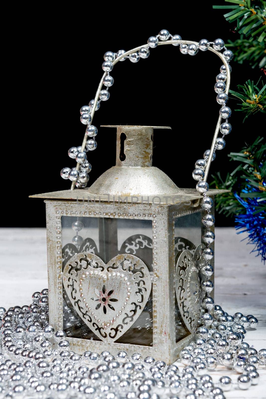 a old lantern with some christmas decorations
