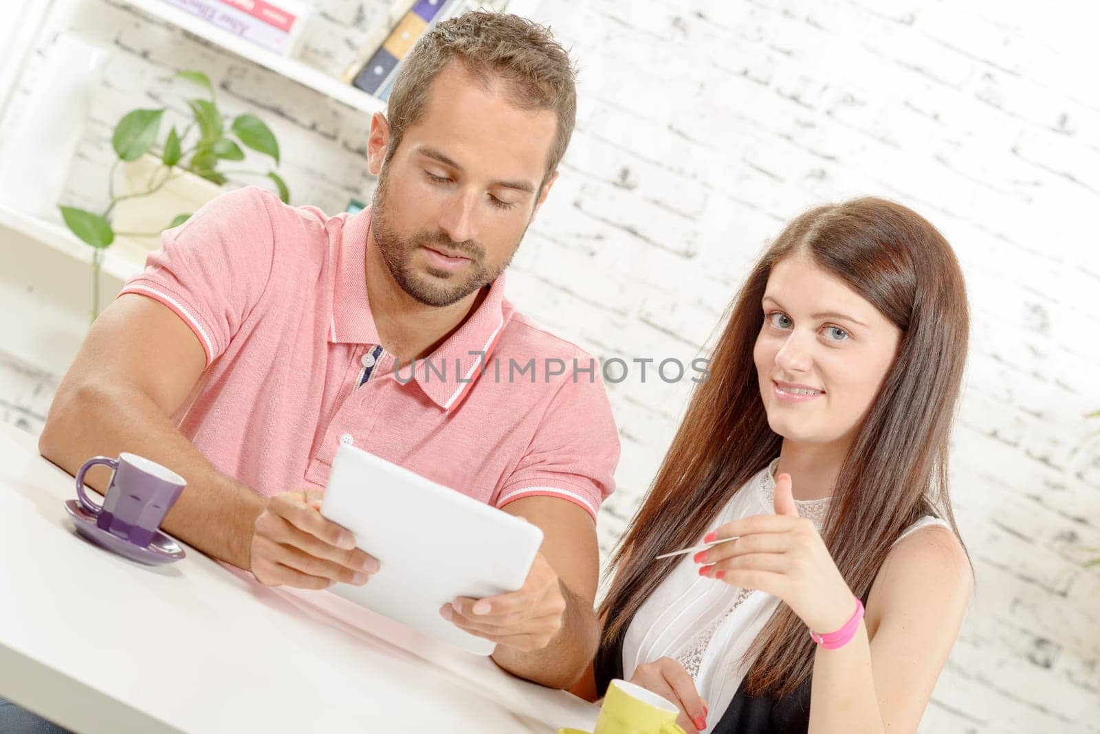 a young couple buying on internet with credit card