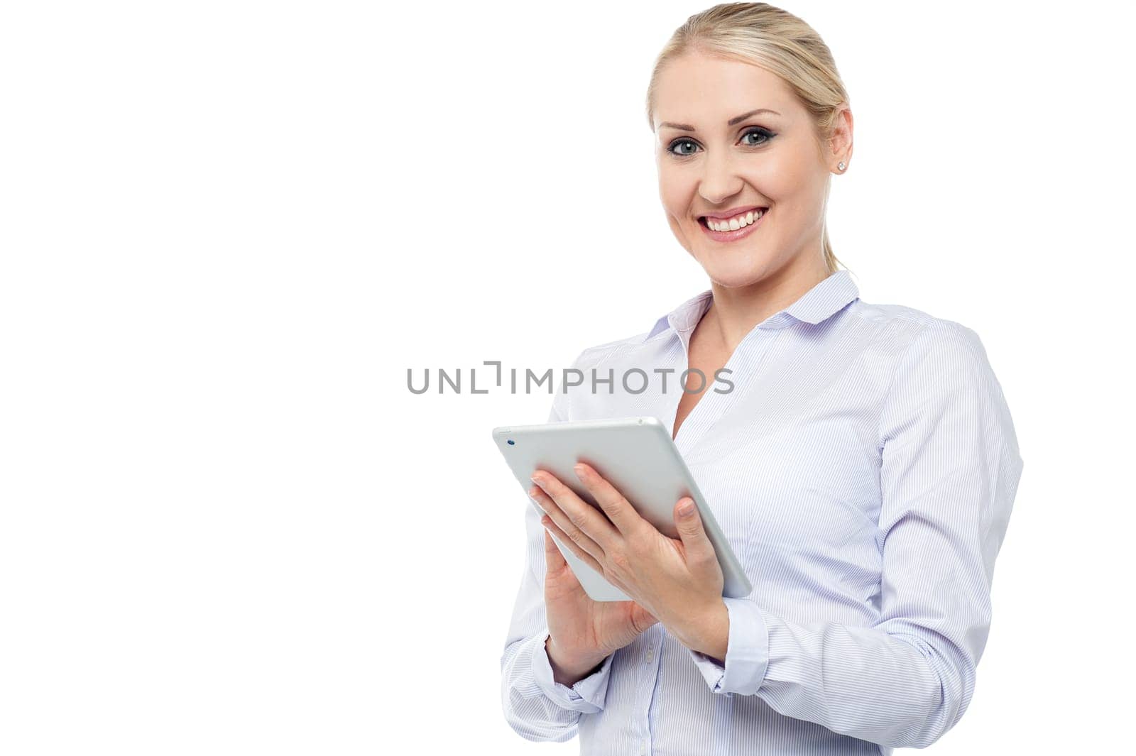 Young beautiful employee surfing on tablet