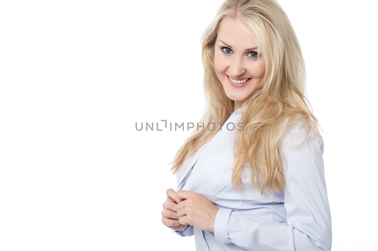 Flirtatious woman unbuttoning her shirt
