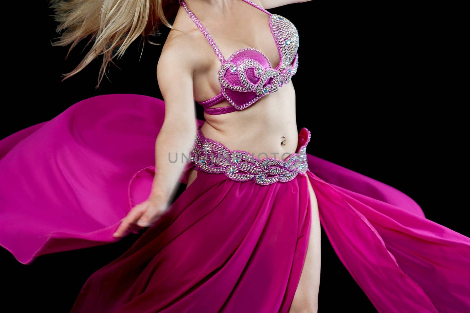 Cropped image of a belly dancer in motion