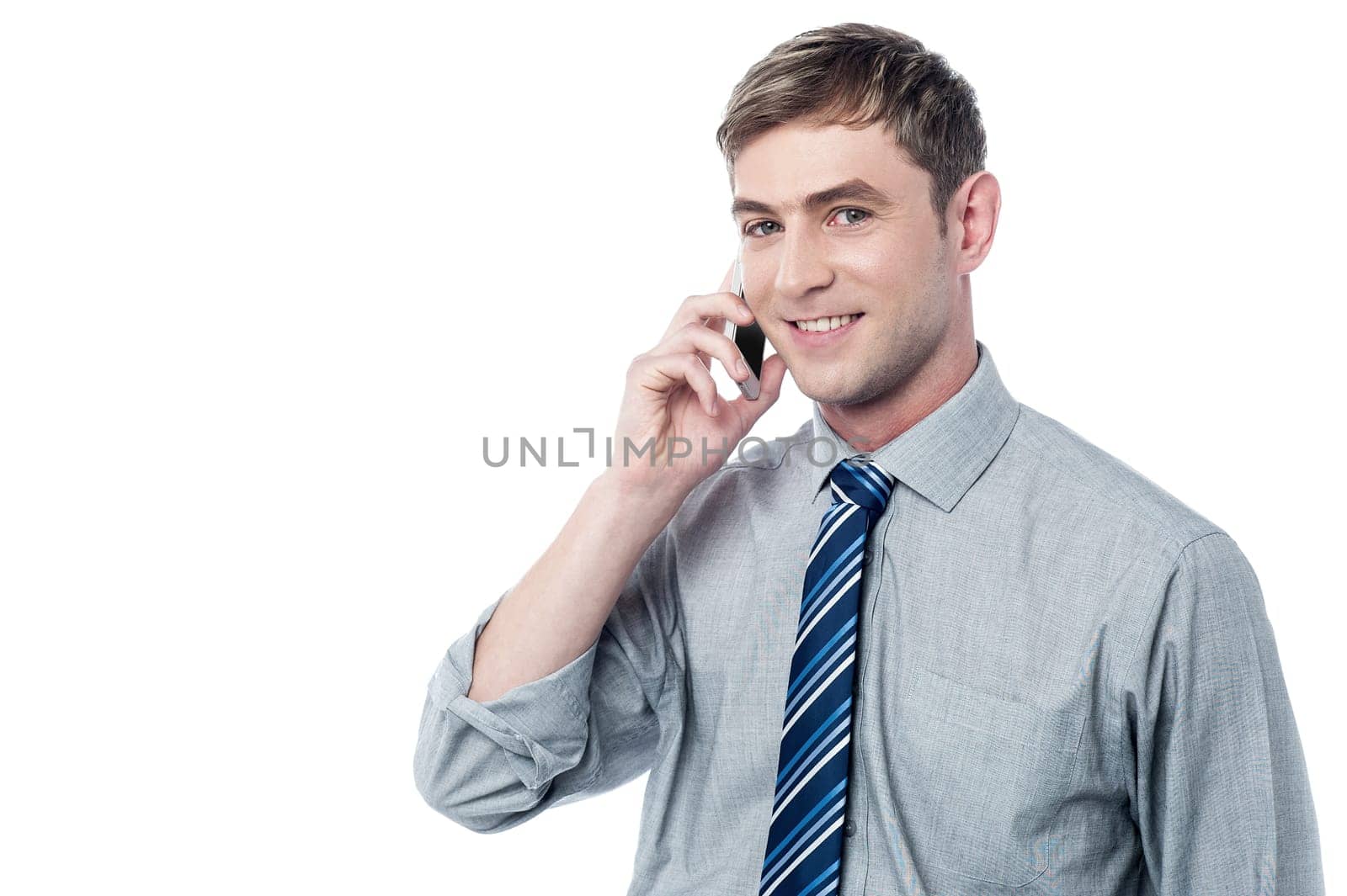 Young handsome employee busy on call