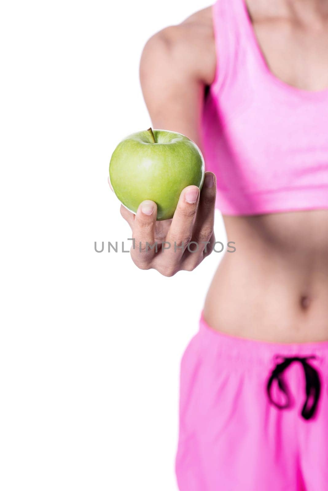 Cropped image of woman showing green apple