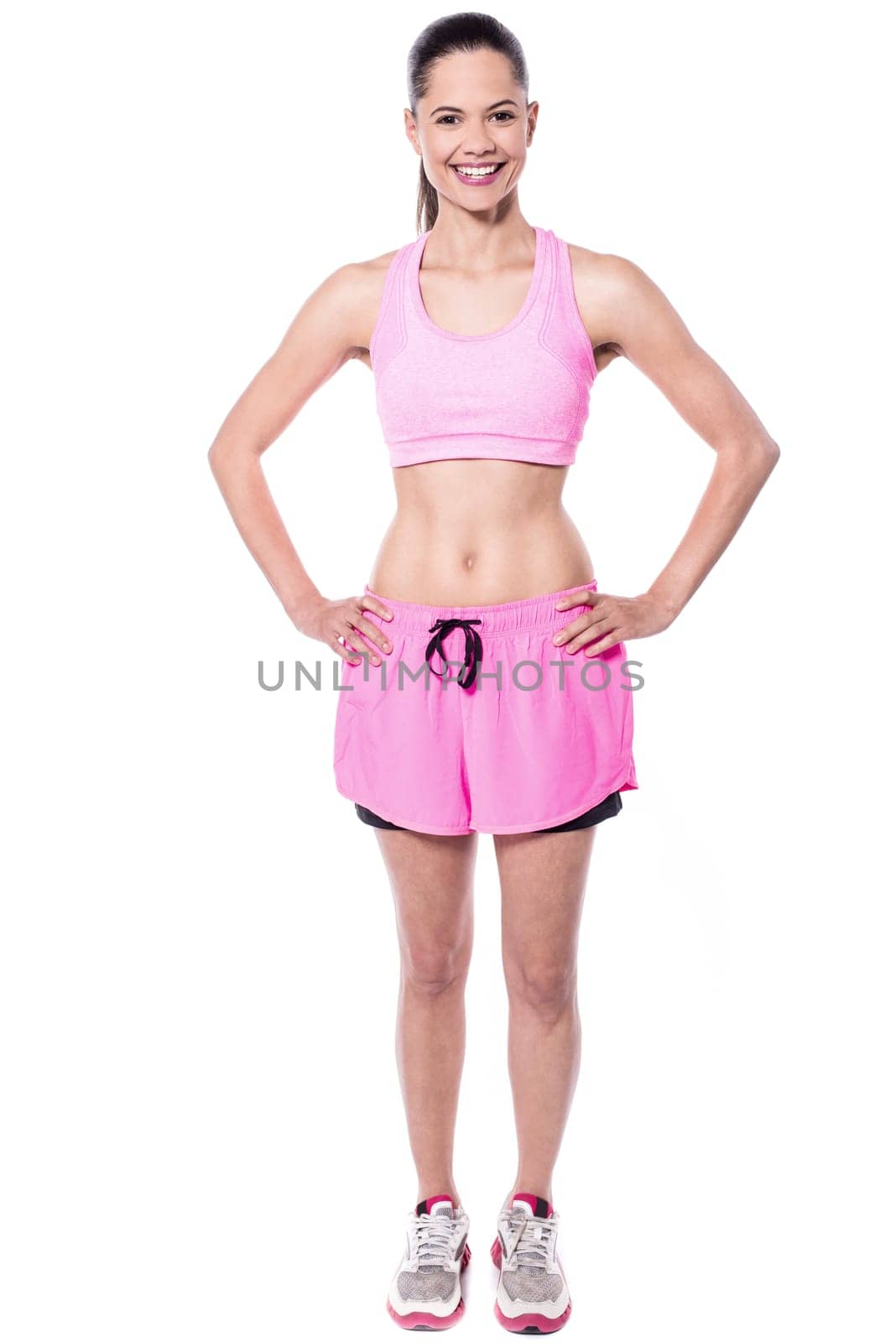 Cheerful fit woman in pink sportswear