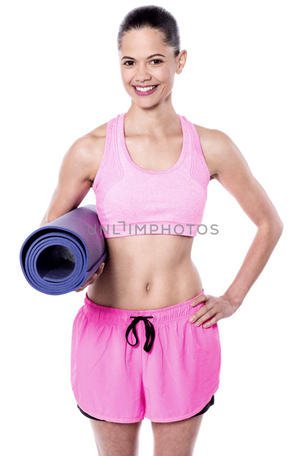 Young woman holding exercise mat