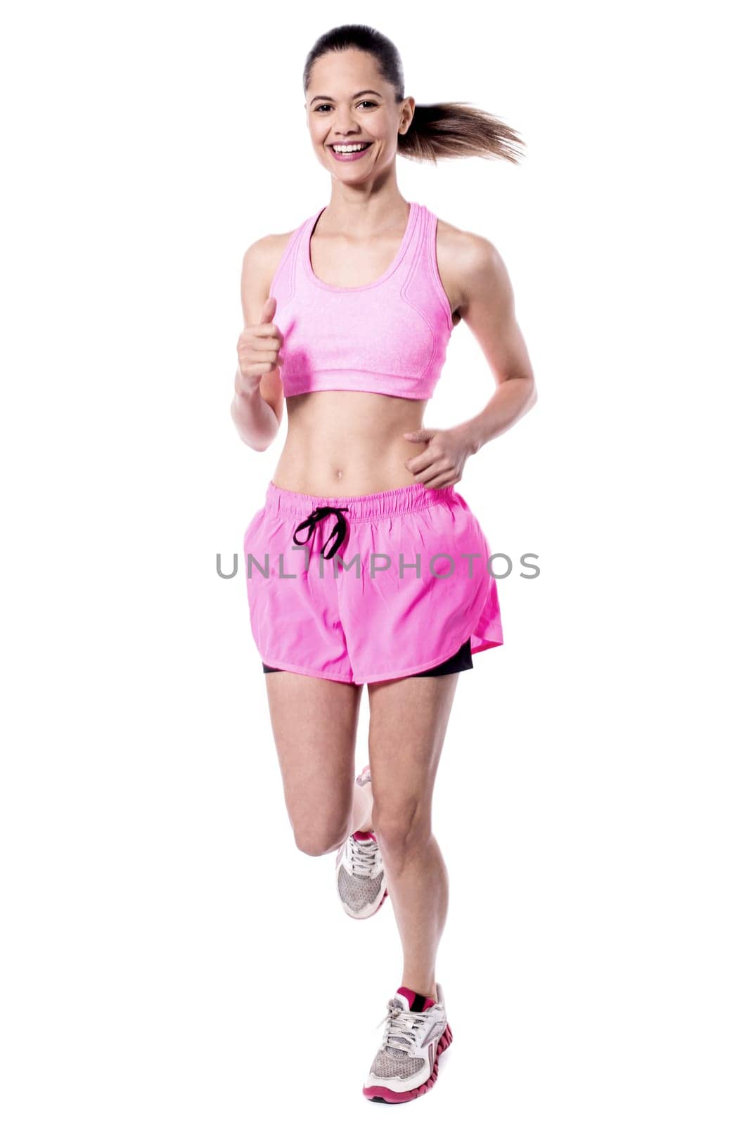 Young  female athlete in running posture