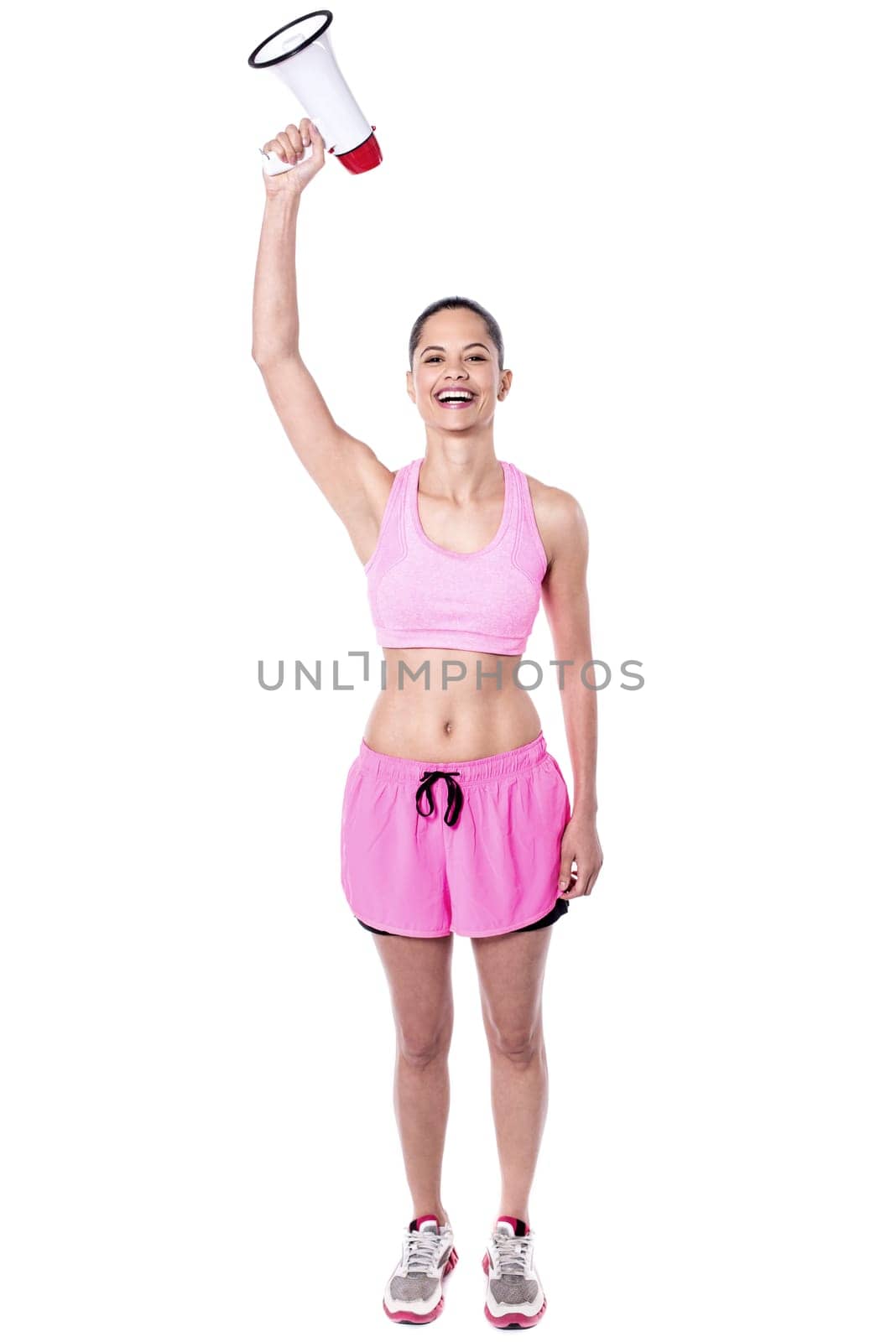 Young woman holding megaphone, arm raised.