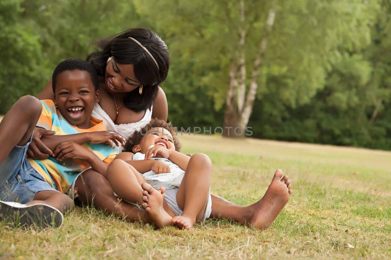 African mother and her kids are having fun in the nature