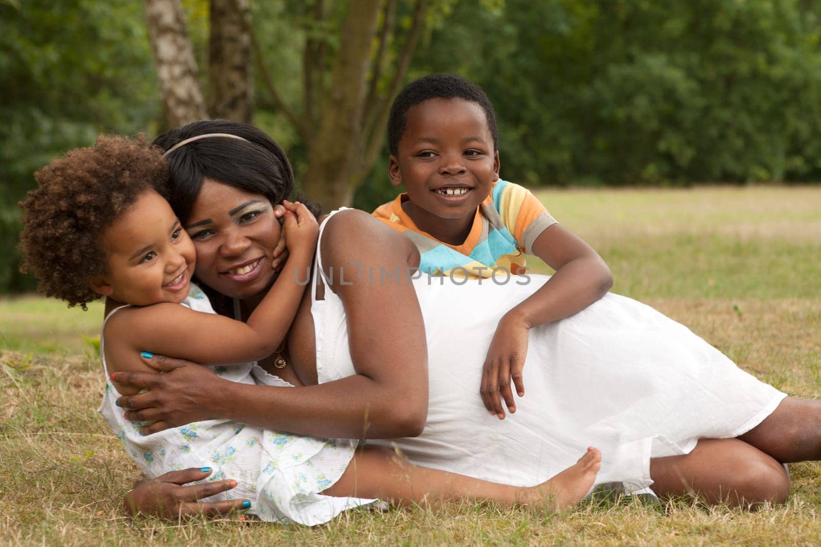 African mother and her kids are having fun in the nature
