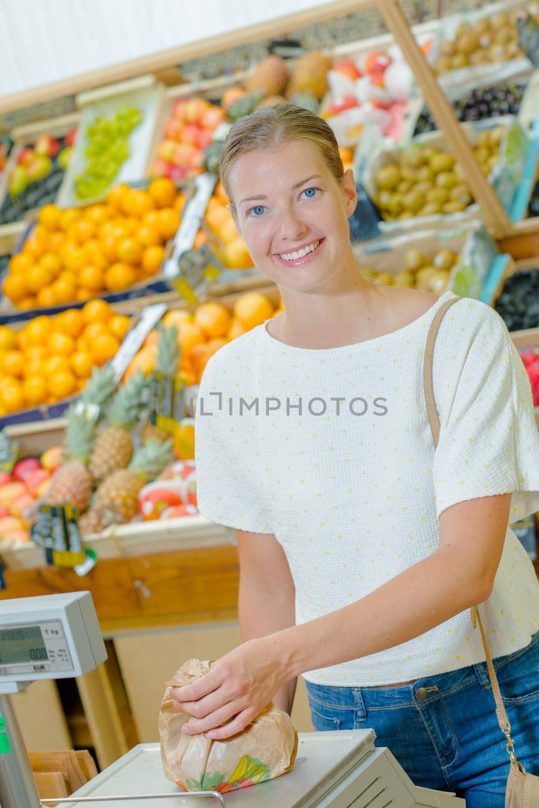 Woman weighing fruit