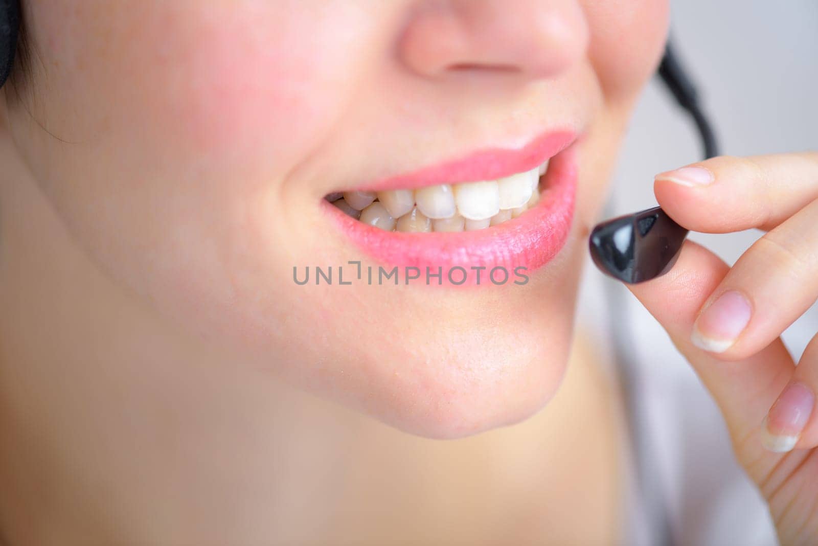 Woman using a telephone head set