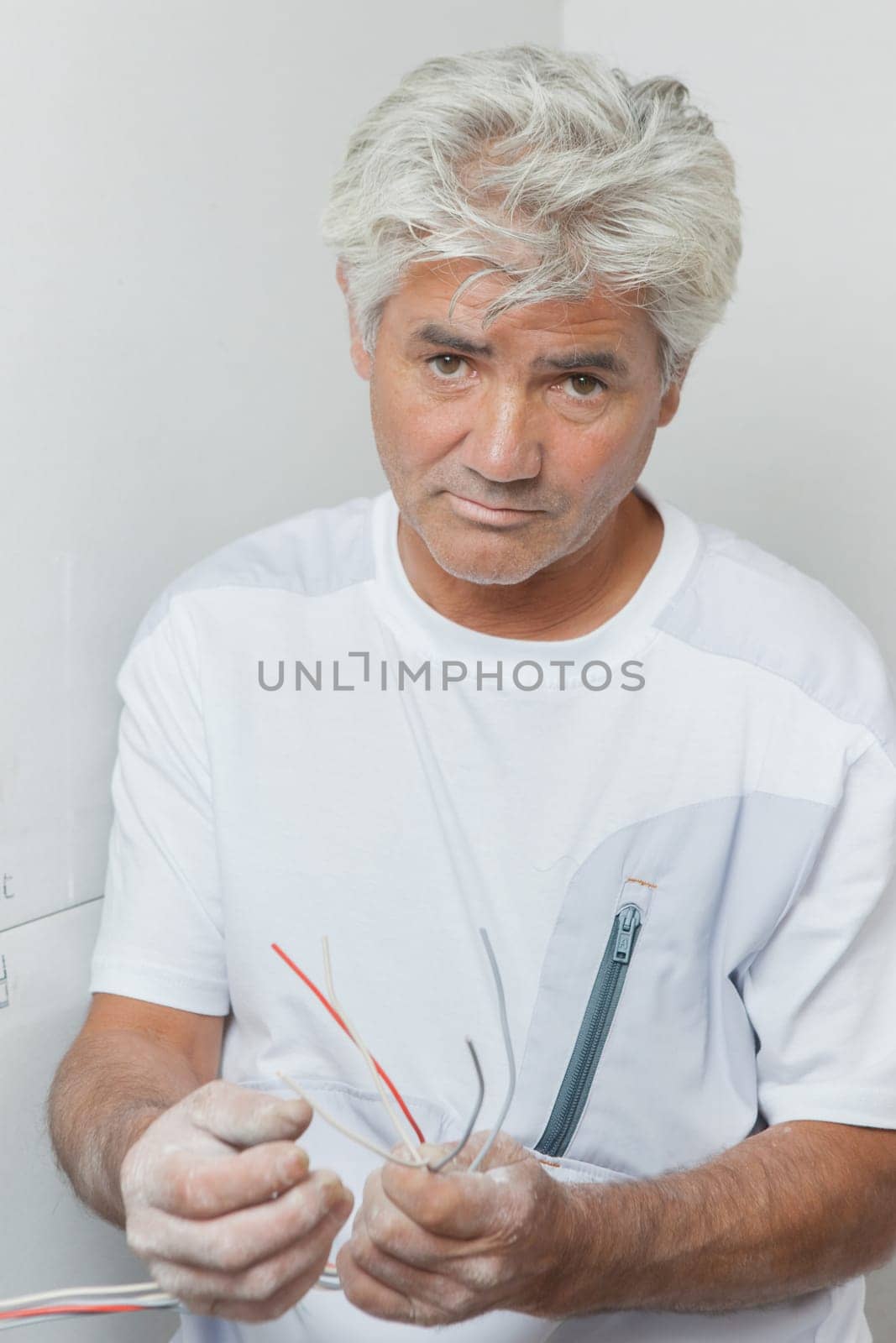 Electrician holding cables
