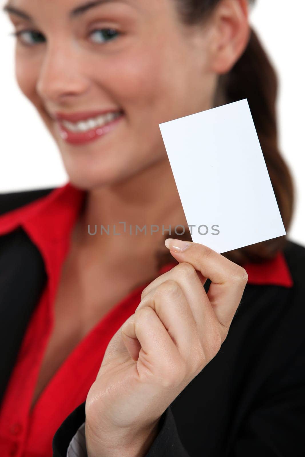 smiling young businesswoman showing business card