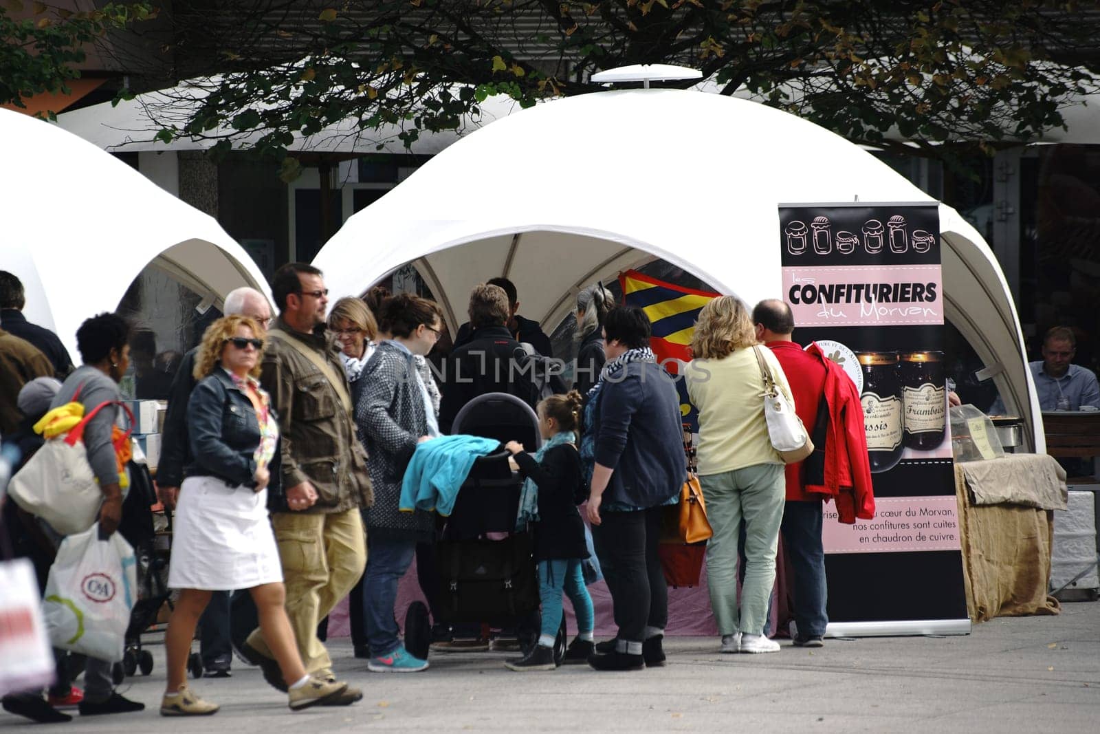 Mainz,Germany - September 04,2015: The stalls of the weekly market in Mainz with visitors on the market square at marktbrunnen on September 4,2015 in Mainz.