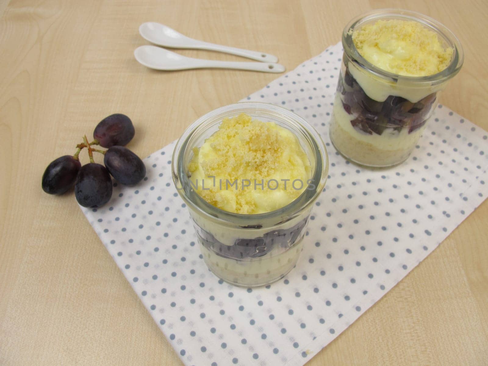 Trifle with vanilla yoghurt,red grapes and biscuit crumbs