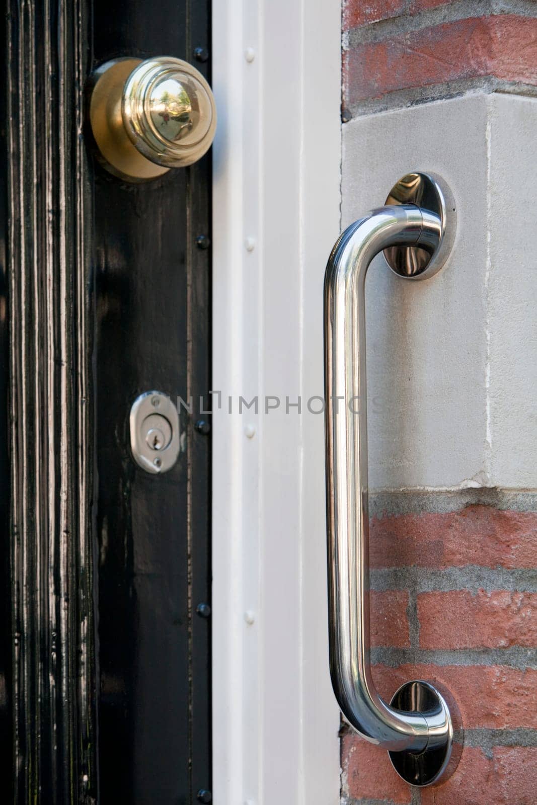 Safety grab handle near a door
