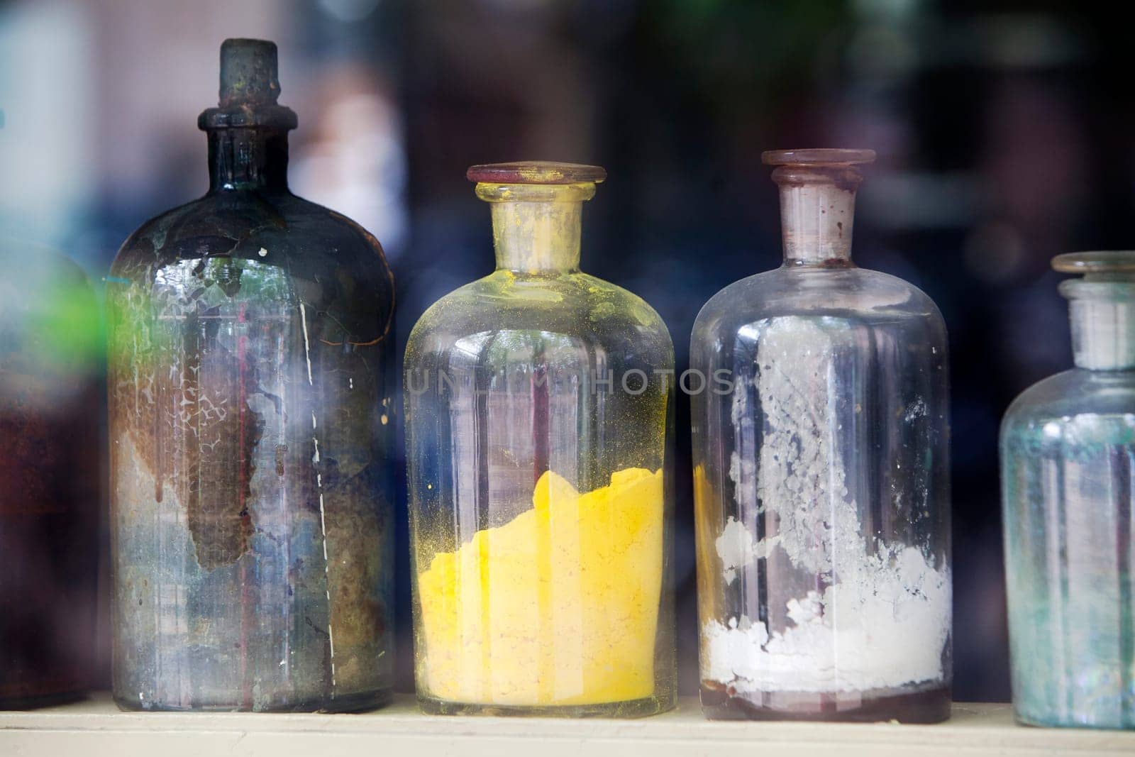 Coloring agent in bottles for giving color to the paint. Focus on the yellow bottle.