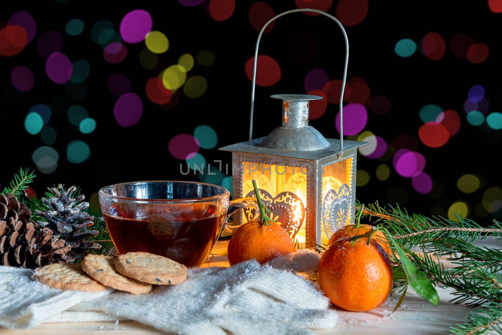 christmas decoration with mandarins and cup of tea