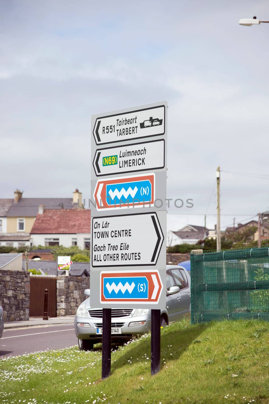 irish road signs in kerry ( car number plate has been altered )