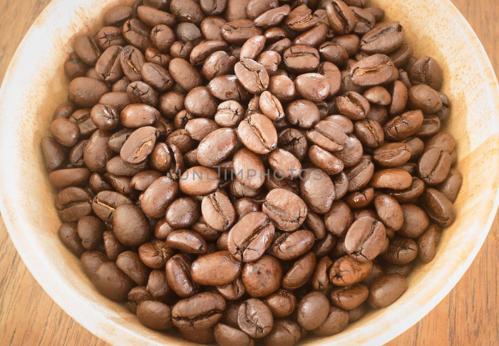 Roasted coffee bean in bowl, stock photo