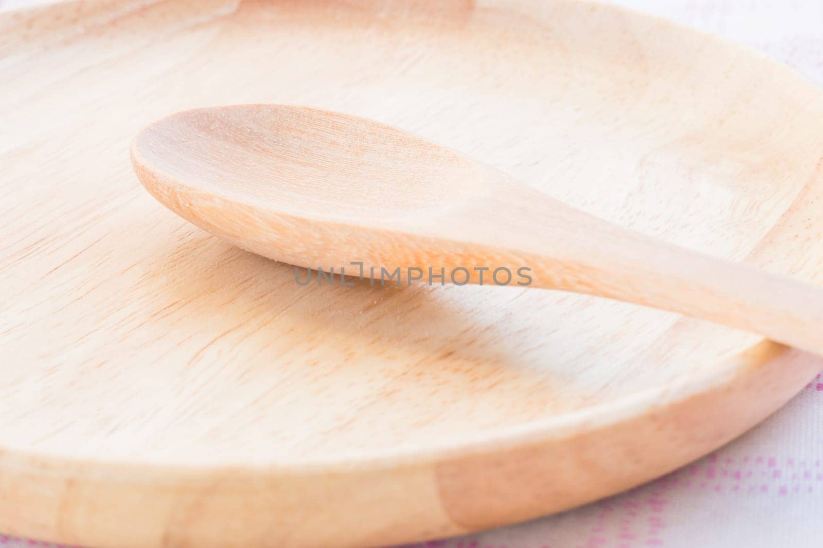 Set of wooden spoon and plate