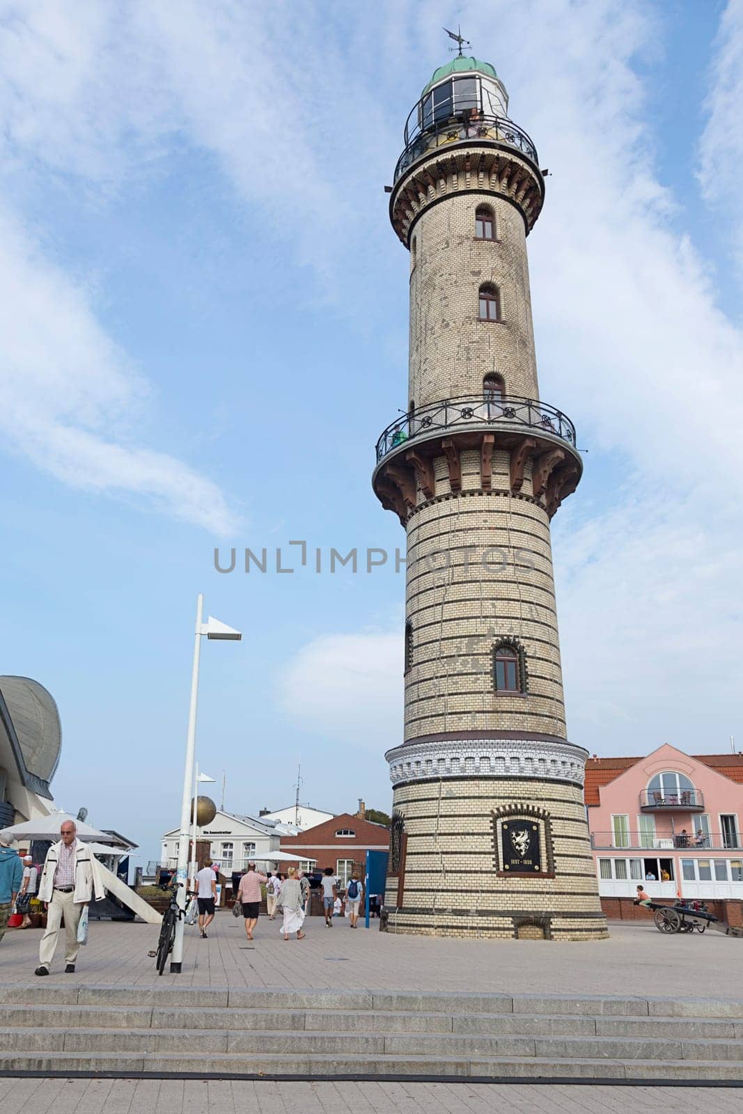 Old lighthouse on the promenade of Warnemünde in the afternoon