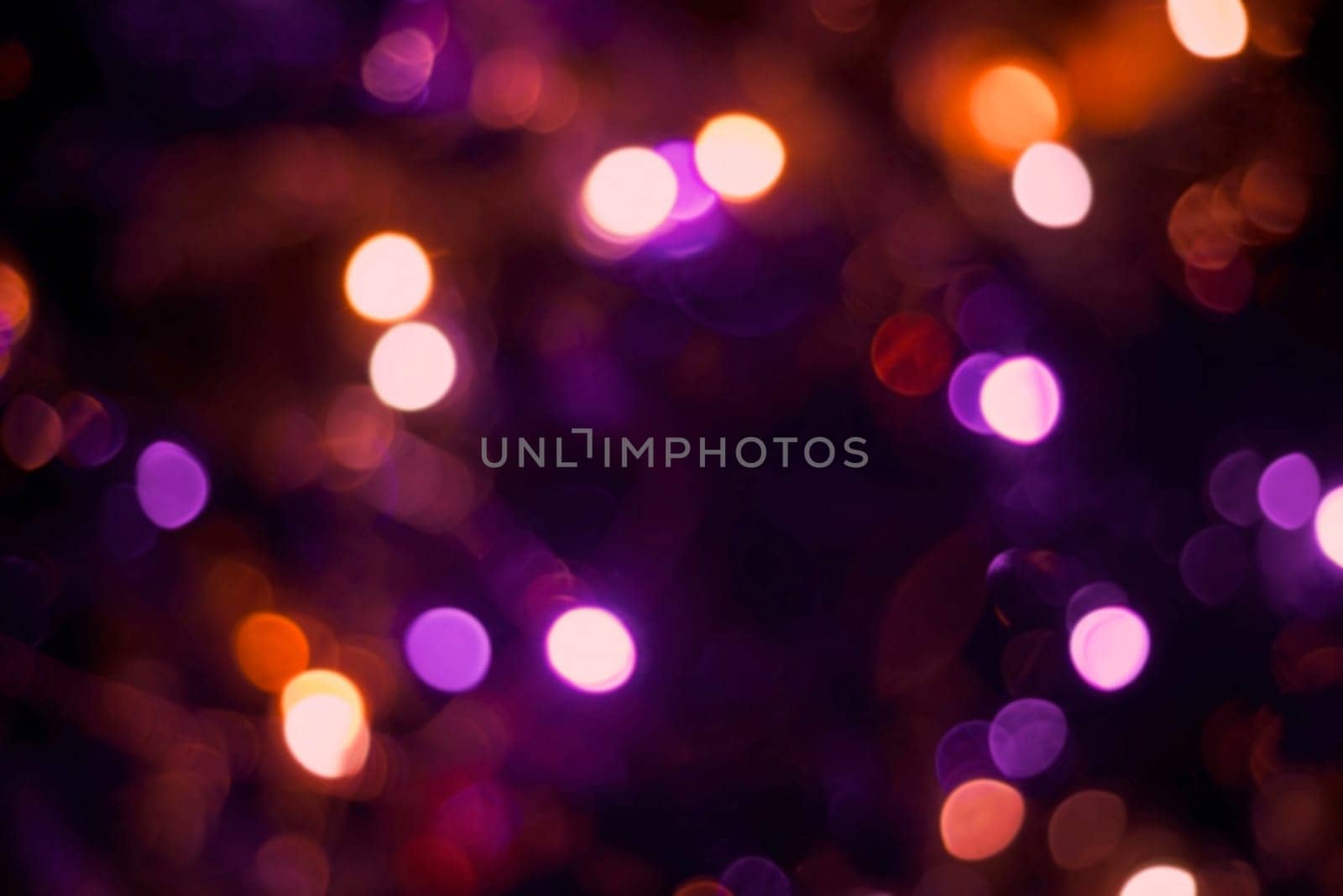 Christmas decoration lights with blur effect, holiday party background. Ideal for greeting card, event invitation or web backdrop.