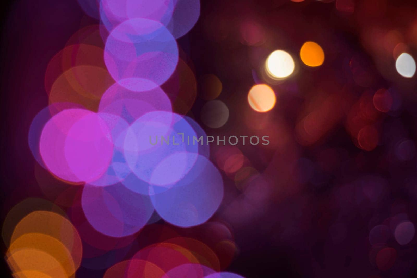 Colorful blur light abstract background with bokeh effect. Ideal for holiday greeting card, party invitation or web backdrop.