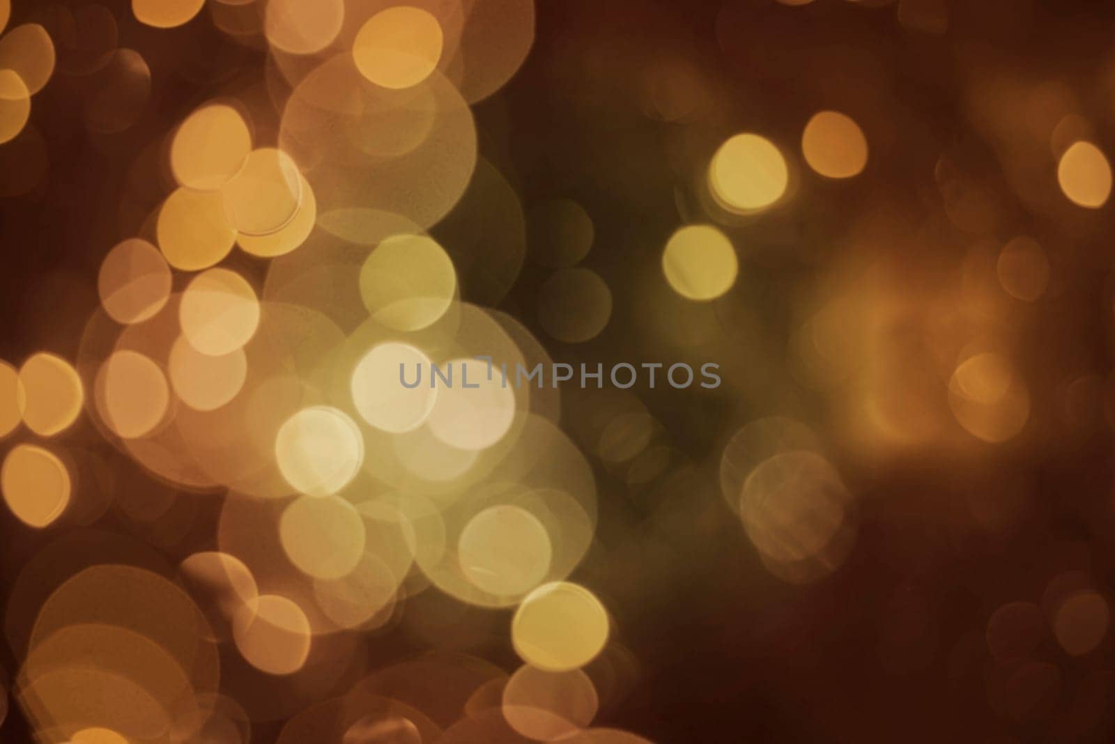 Blur lights glitter background, bokeh effect in gold color. Ideal for celebration, holiday greeting card or event invitation.   .