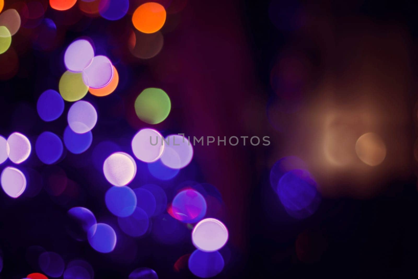 Colorful Christmas lights with bokeh blur effect, abstract background. Ideal for holiday greeting card, event invitation or web backdrop.   .