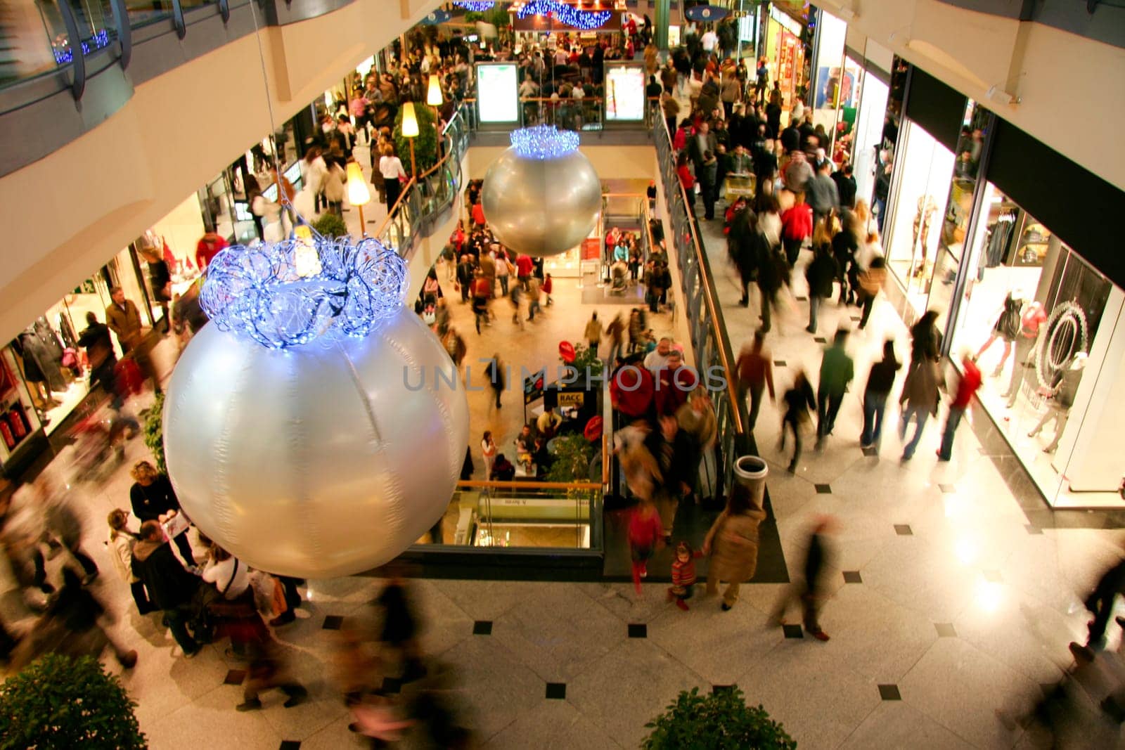People Shopping For Christmas In Luxury Shopping Mall Interior. Low motion shot