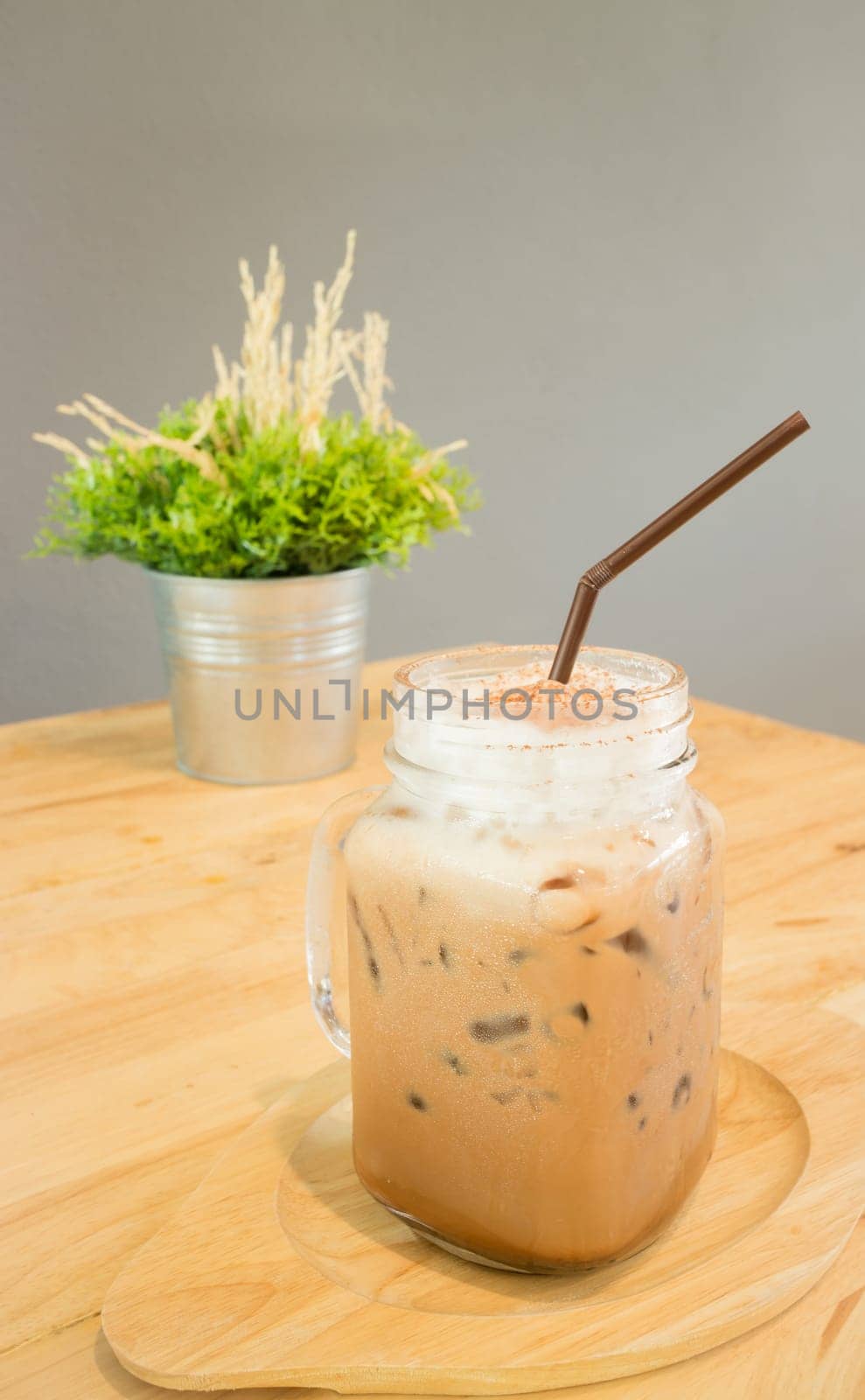 Iced cofee mocha drink serving on wooden table, stock photo