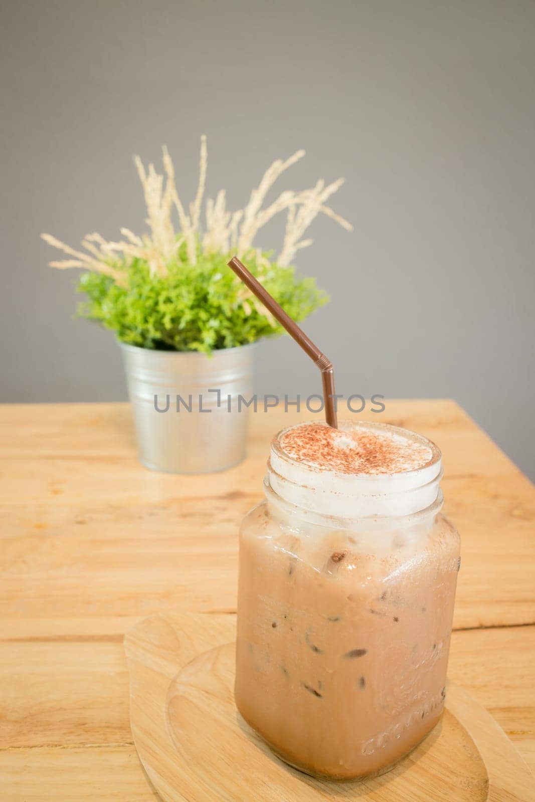 Iced cofee mocha drink serving on wooden table, stock photo