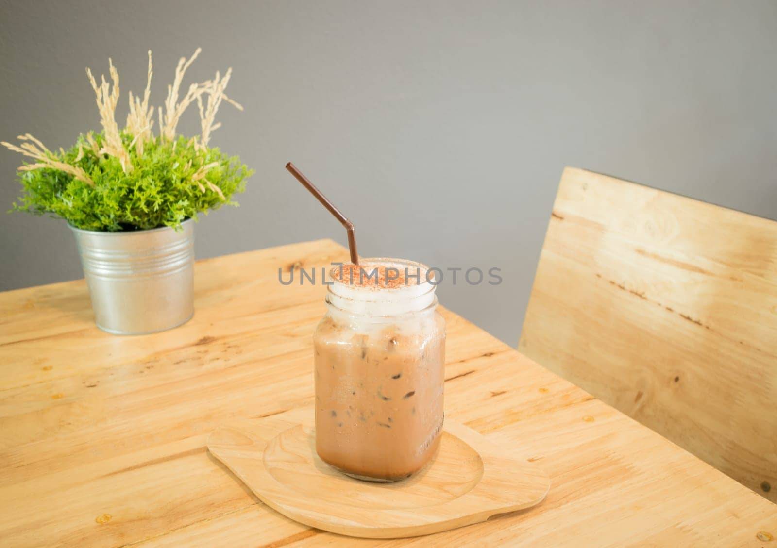 Iced cofee mocha drink serving on wooden table, stock photo