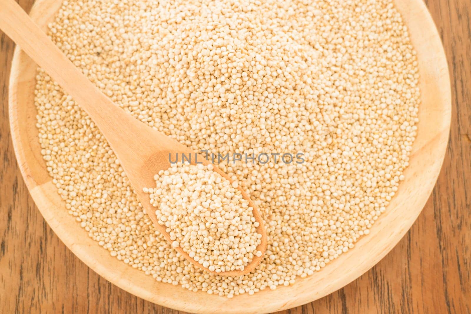 Quinoa grain in wooden plate, stock photo