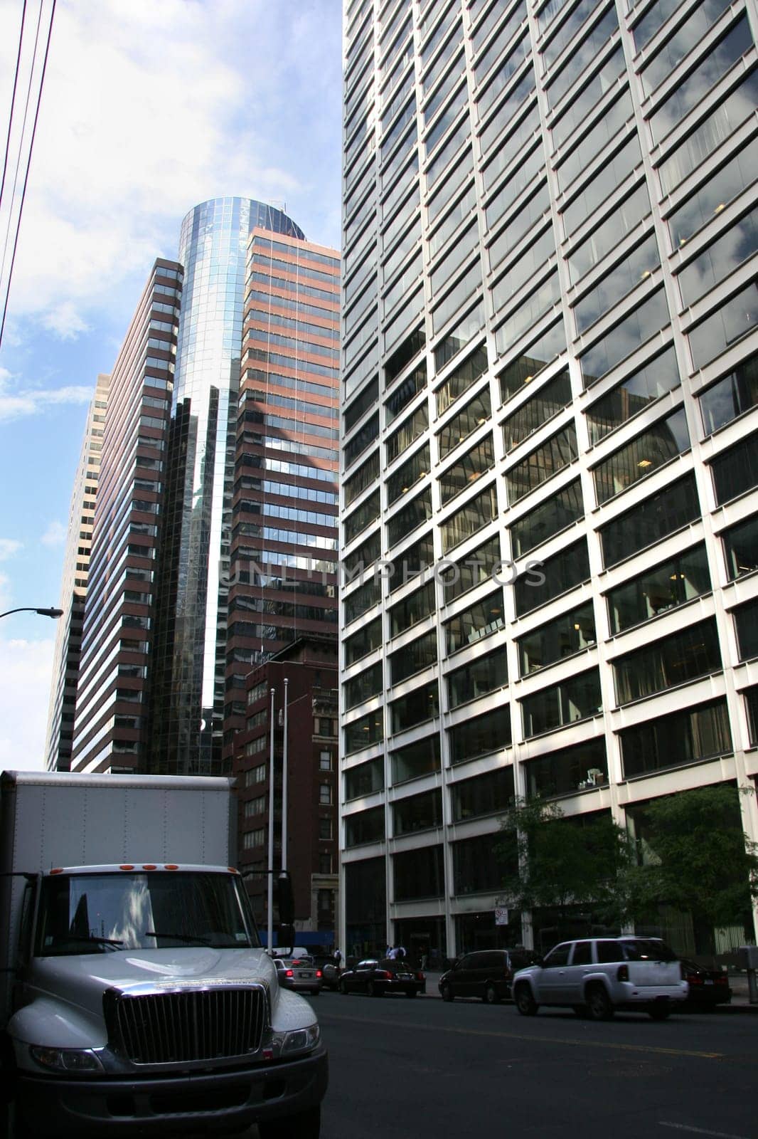 New York delivery truck by a city street scene with the skycrapers at bottom