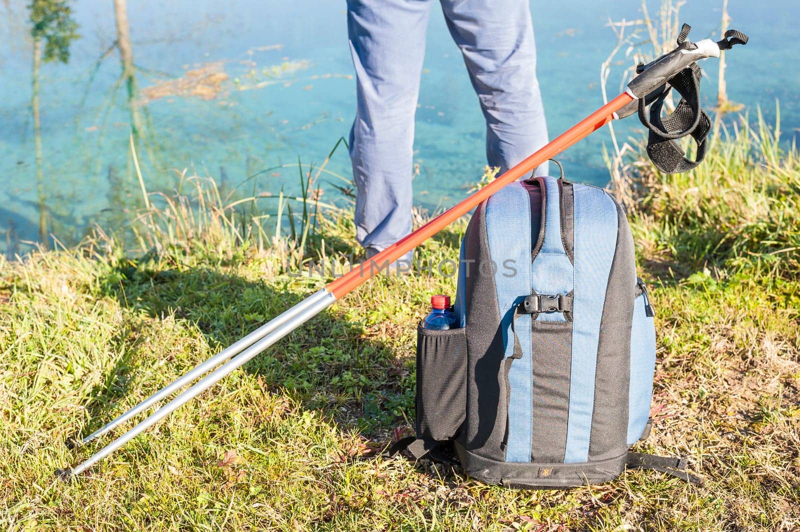 Backpack and sticks to do nordic walking on country roads.