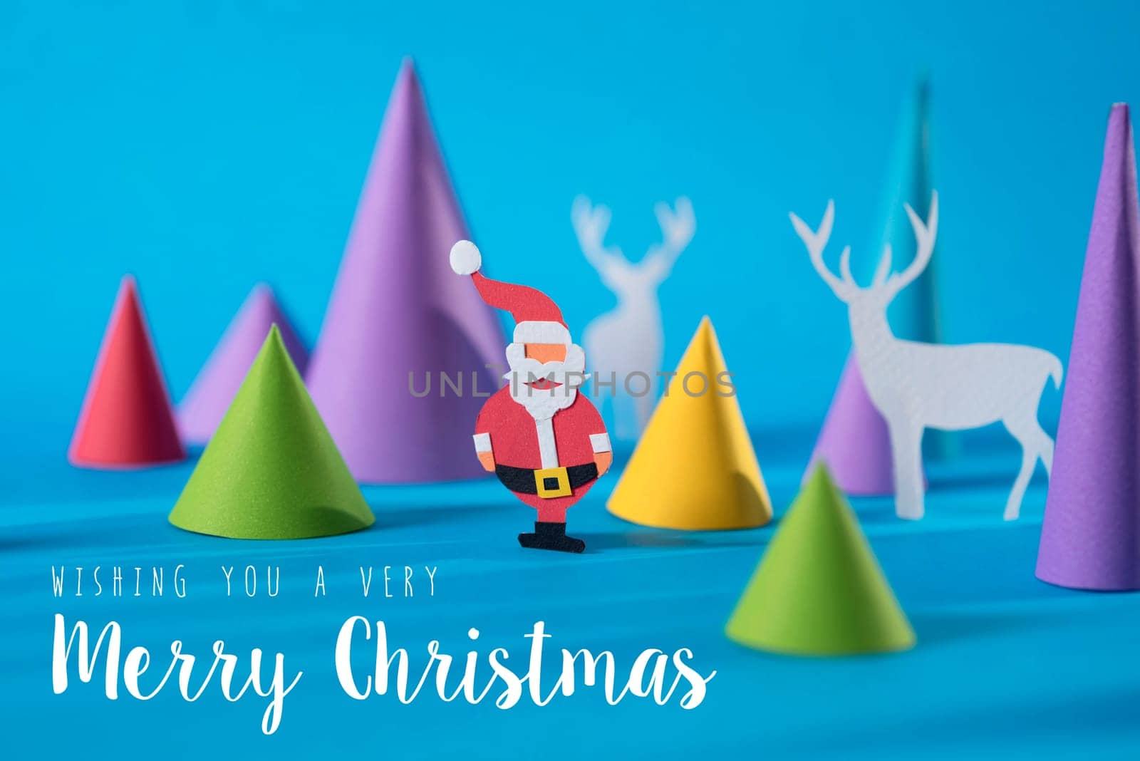 Merry Christmas handmade paper cut santa and deer with colorful 3d cone pine tree shapes.Illustration background ideal for xmas greeting card, poster or campaign.