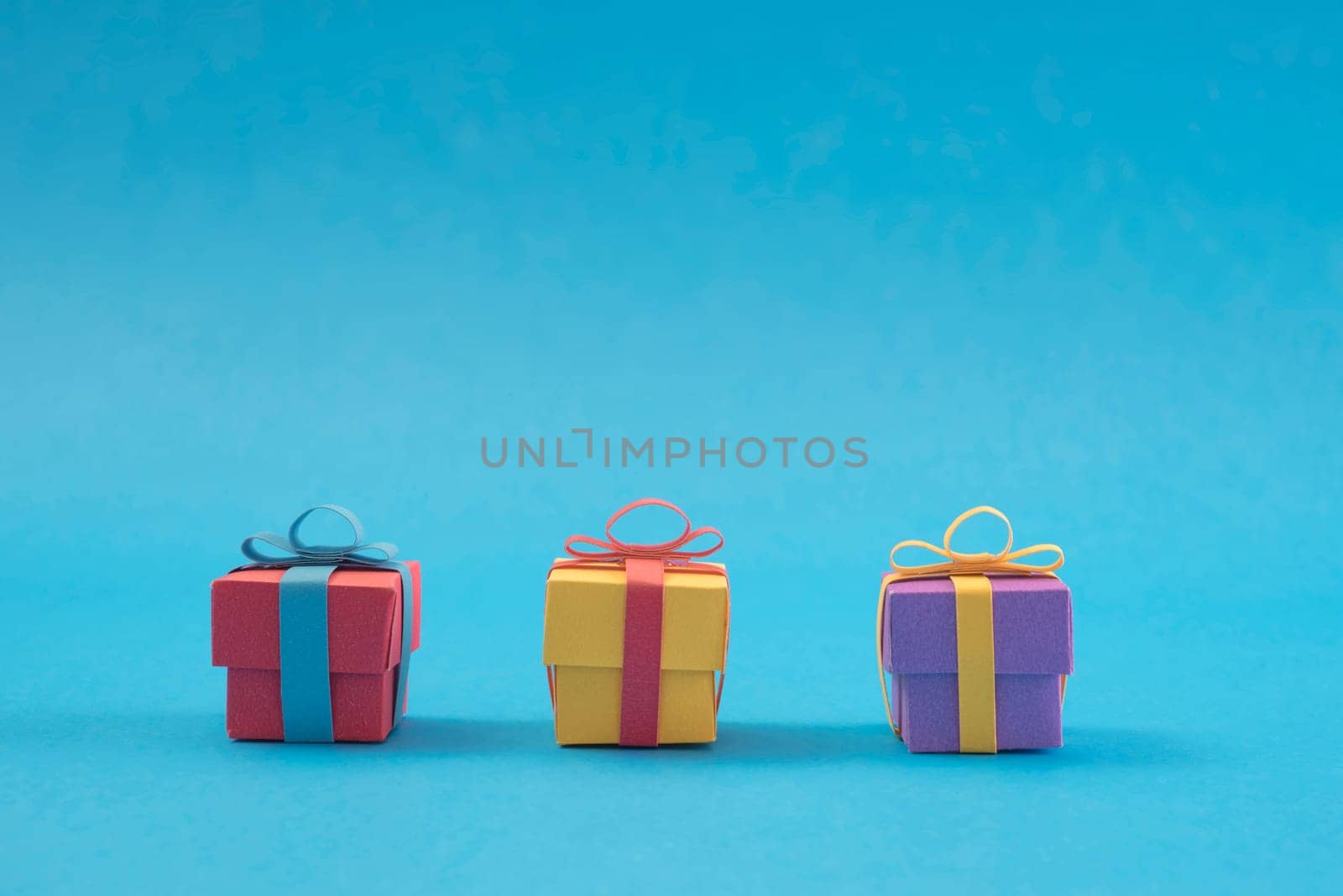 Concept handmade paper cut holiday gift boxes. Ideal for christmas greeting card, campaign, poster or web. Includes clipping path to place objects on your designs.
