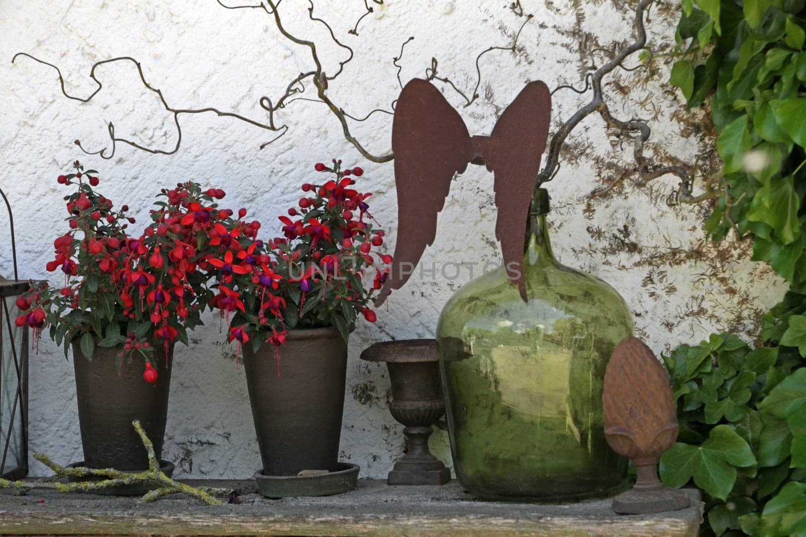 Still life with flowers,bottle and angel wings